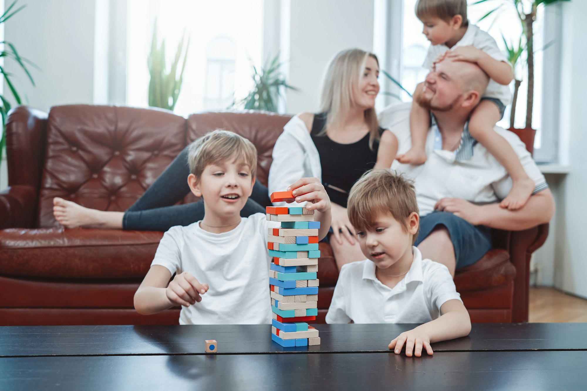Happy family with their children have fun and relax at home