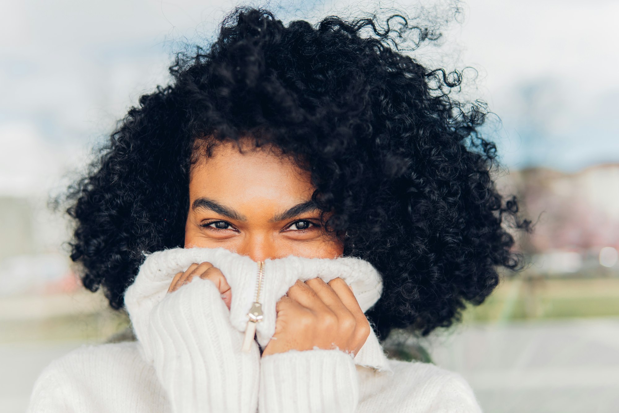 Portrait of a young woman alone with a look of happiness and innocence